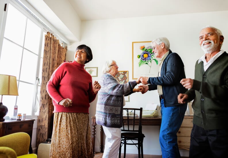 Group of Seniors Dancing Inside Senior Independent Living Apartment Group of Seniors Dancing Inside Senior Independent Living Apartment